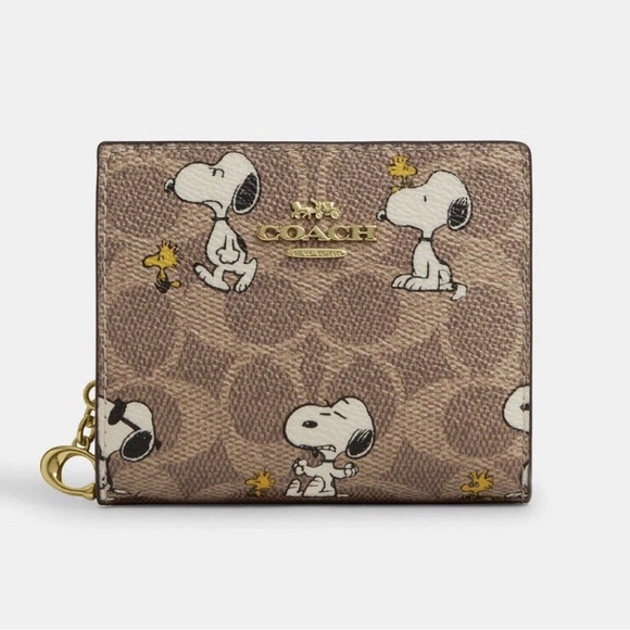 Coach Handbags - SOLD💕 Coach X Peanuts Snap Wallet In Signature Canvas With Snoopy Print CBN32